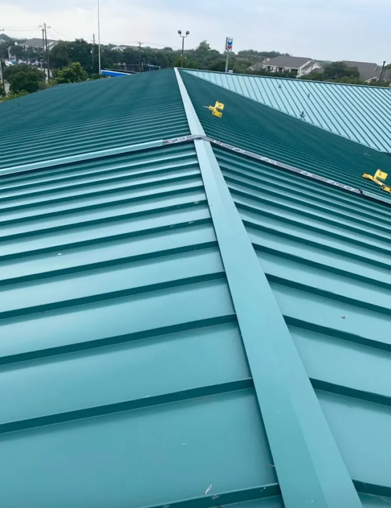Green commercial metal roof ridge and valley for Metal Roof Repair in Conneaut