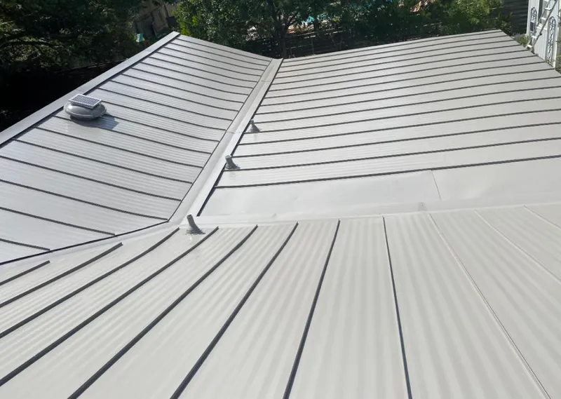 Solar attic fan installed on a metal roof for Roof Ventilation in Conneaut